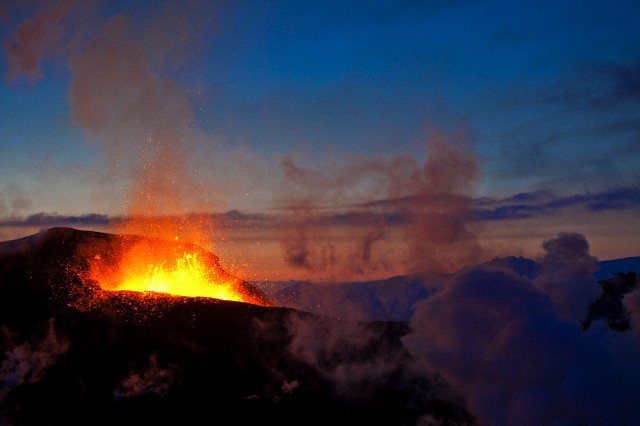 Erupting volcano between Eyjafjallajoekull and Myrdalsjoekull glaciers, Iceland, Europe triassico